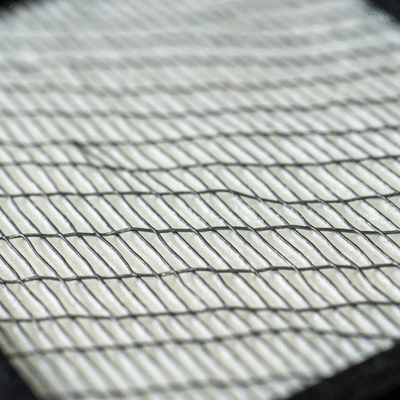 Close-up of HEPA filter fibers trapping microscopic dust particles